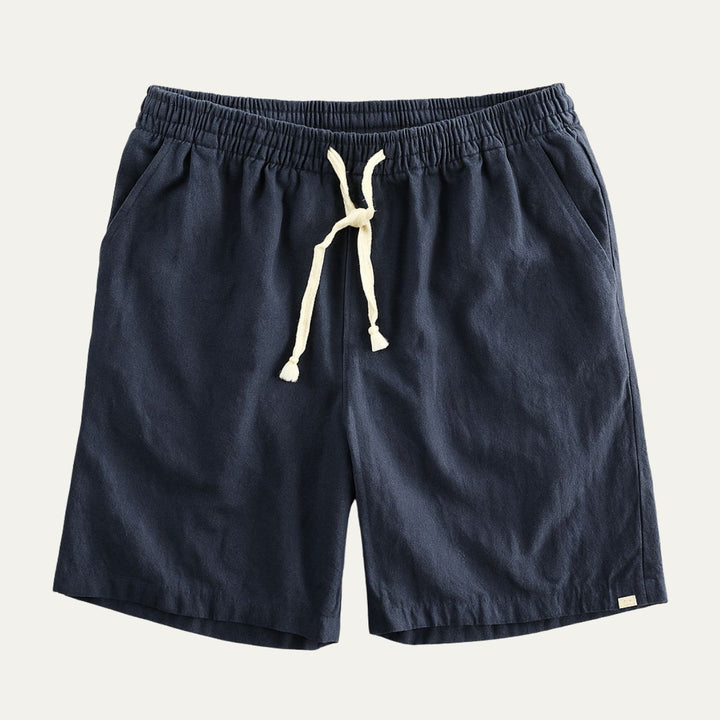 Navy men's linen shorts with elastic waist, drawstring tie, and side pockets