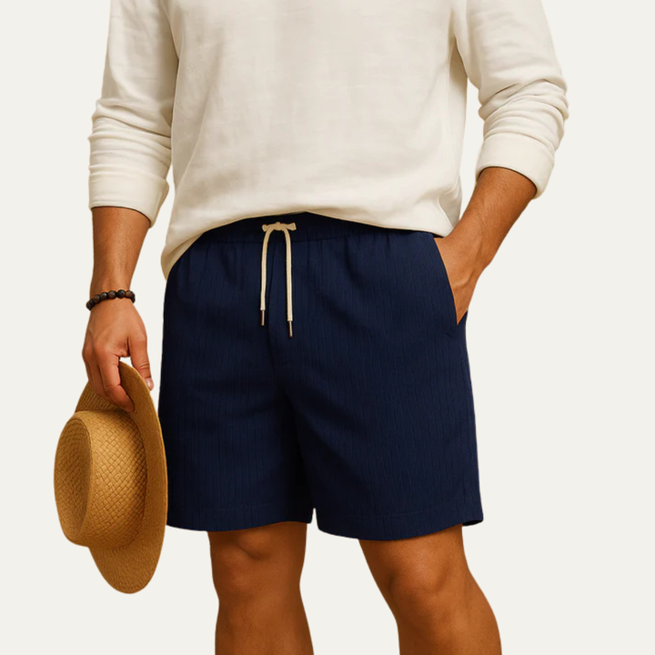 Navy blue striped drawstring shorts styled with a white shirt, men's summer shorts