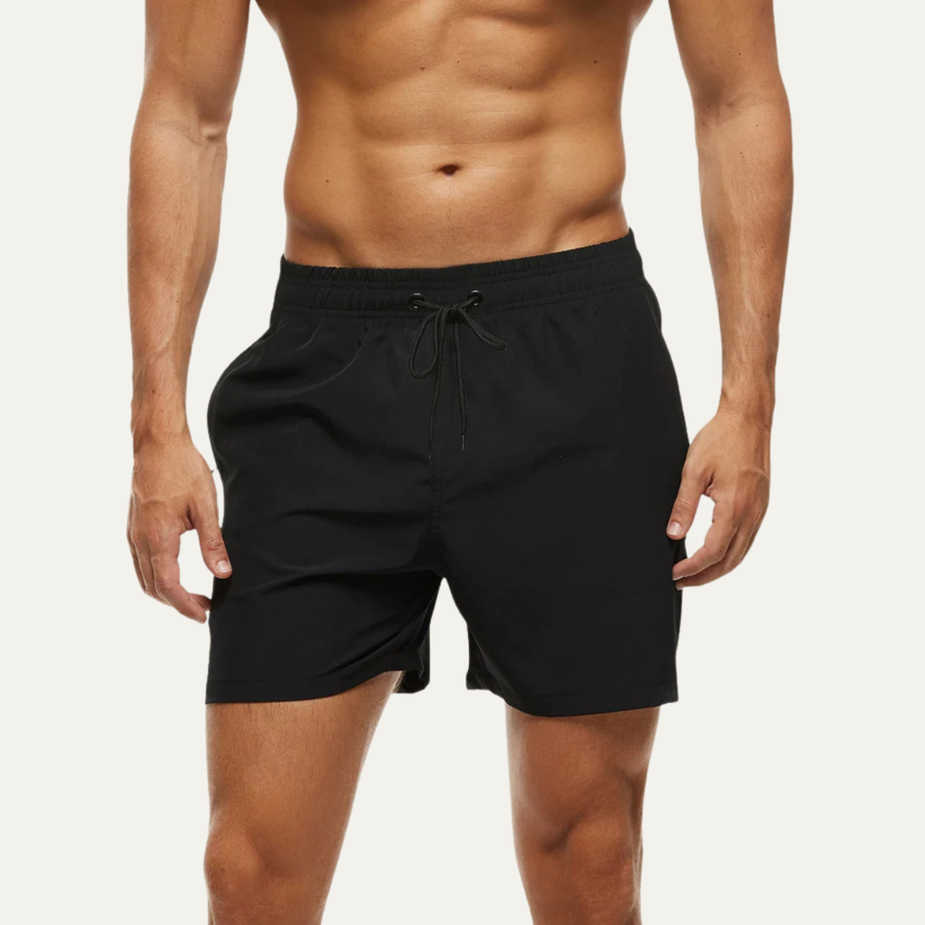 Black swim shorts for men shown on model, mid-length summer bathing suit style