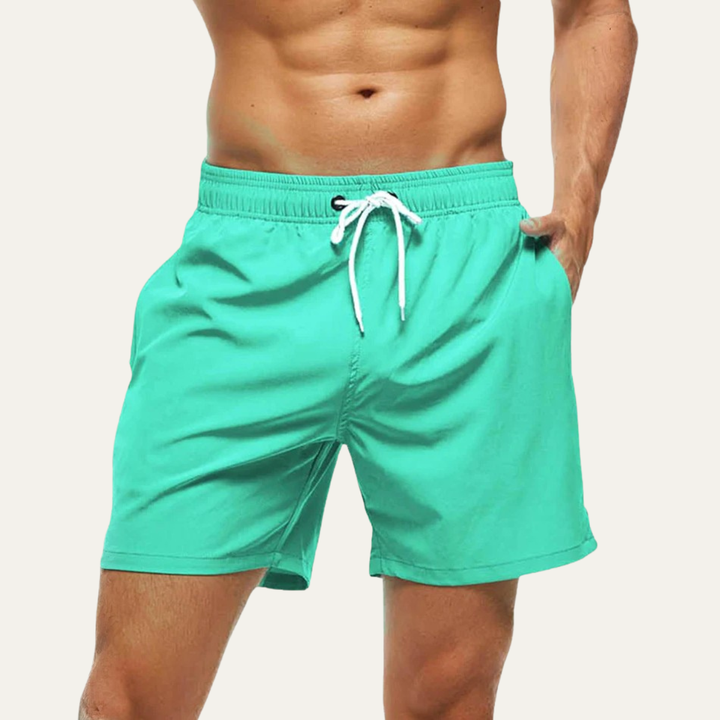 Mint green men summer swim shorts with white drawstring and side pocket detail