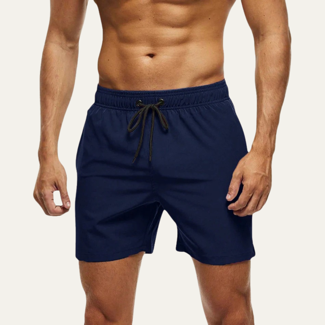 Navy blue men swim shorts with elastic waistband and drawstring, front model view