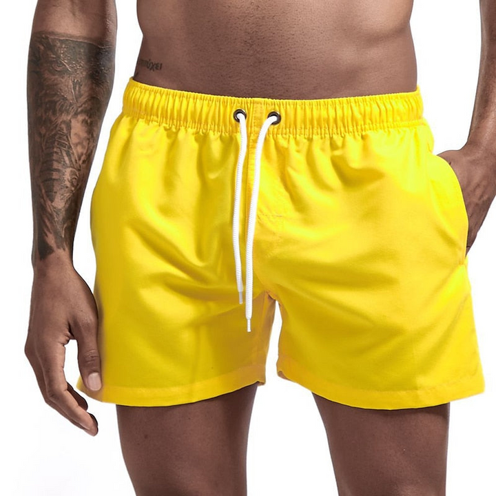 Yellow men swim shorts with elastic waistband, drawstring, and side pocket for swimming
