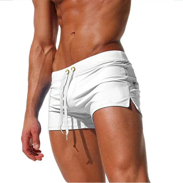White men swim shorts with drawstring, side slits, and fitted short length
