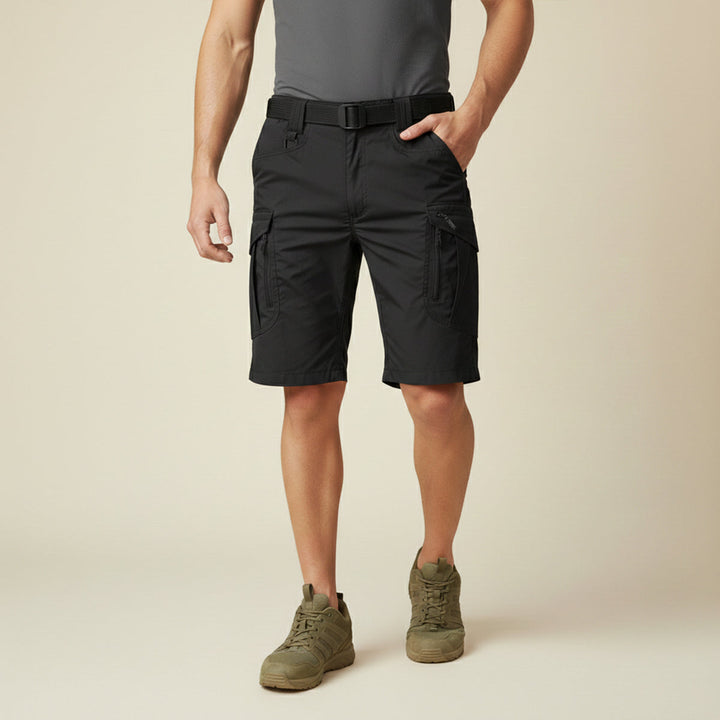 Model wearing black tactical cargo shorts with pockets and black belt