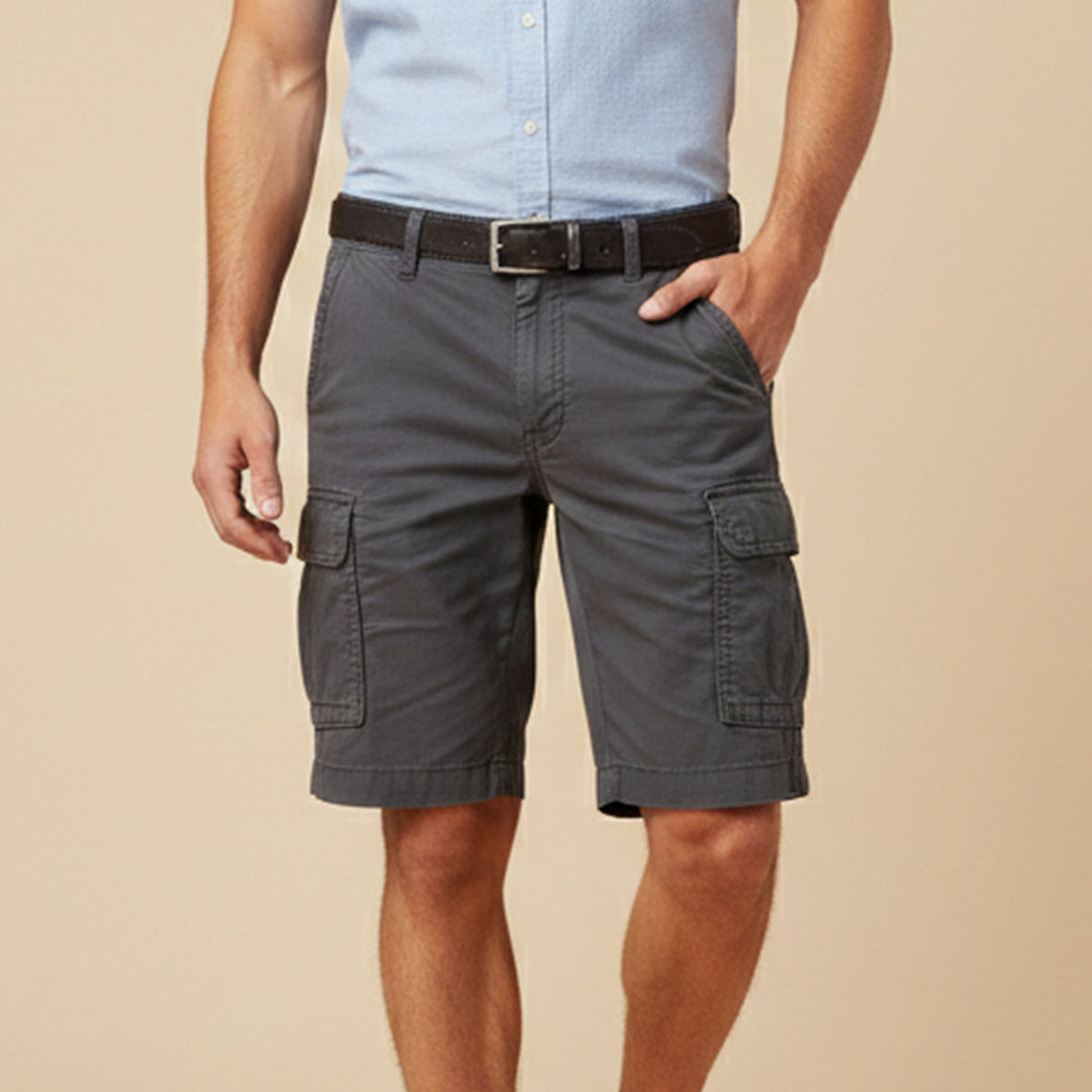 Charcoal gray cargo shorts with side pockets and belt on a model against a plain background