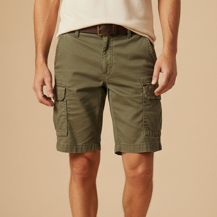 Olive green tactical cargo shorts with pockets, front view on white background