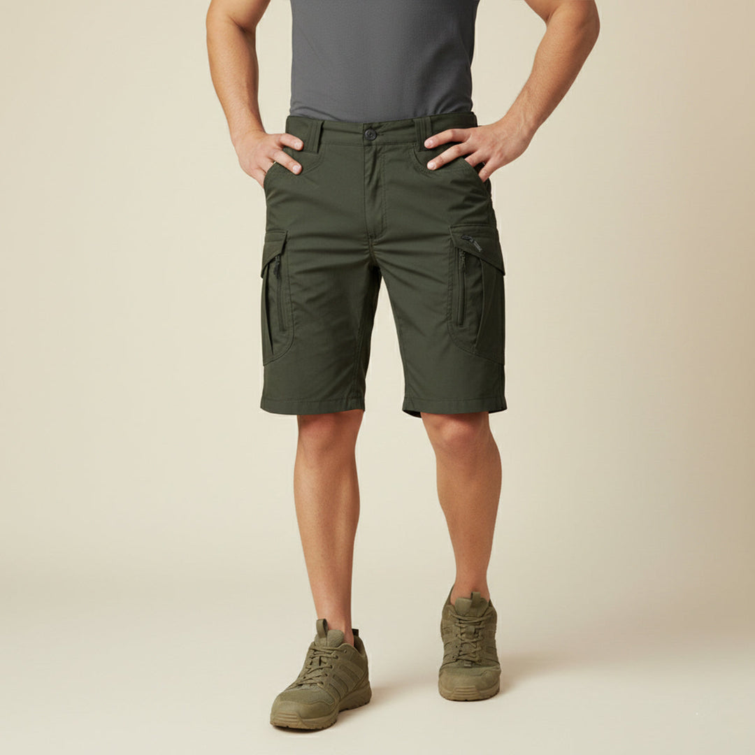 Model wearing dark green tactical cargo shorts with pockets and black belt