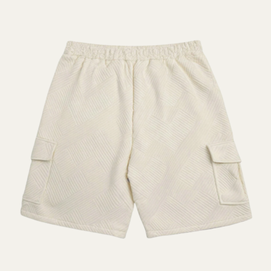 Back view of cream textured cargo shorts with elastic waistband and knee-length cut