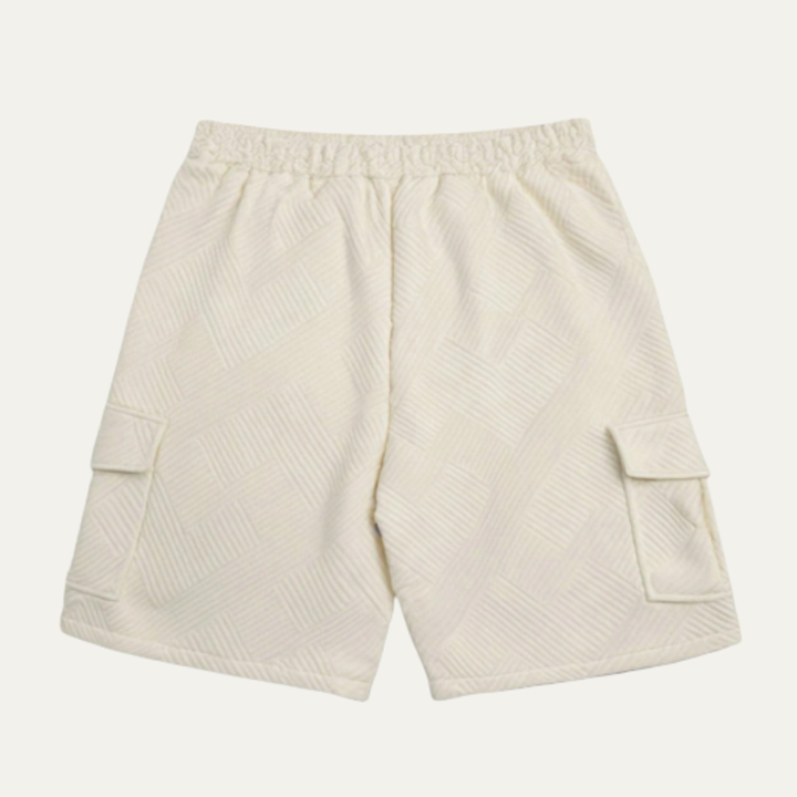 Back view of cream textured cargo shorts with elastic waistband and knee-length cut