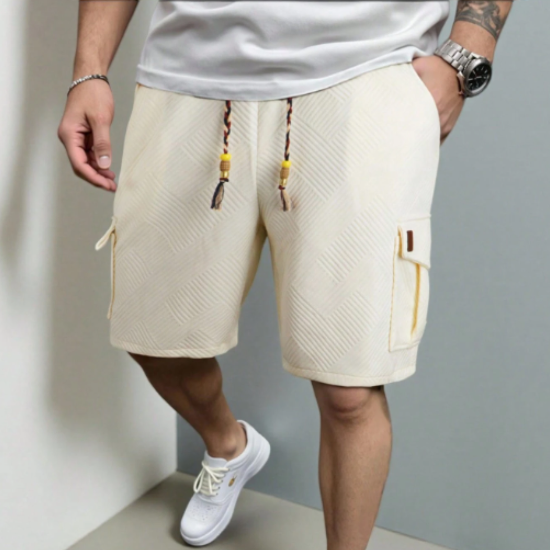 Model wearing cream textured cargo shorts with drawstring waist and cargo pockets