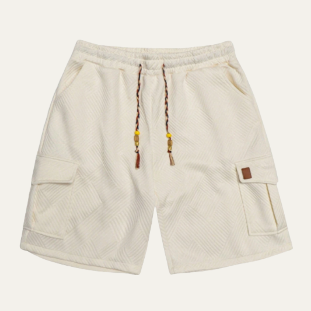 Cream textured cargo shorts with drawstring waist and side flap pockets, front view