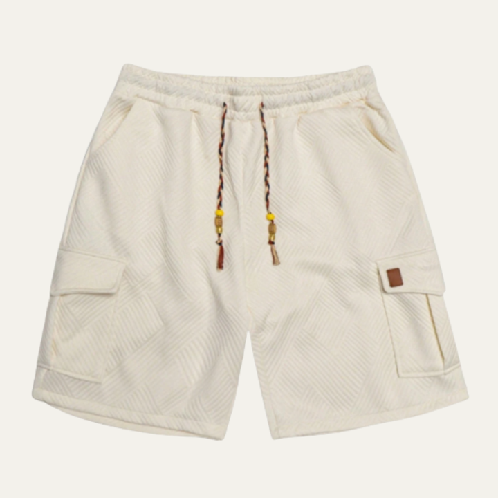 Cream textured cargo shorts with drawstring waist and side flap pockets, front view