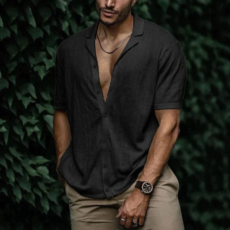 Black textured short sleeve Cuban collar shirt with open neckline and laid-back summer look