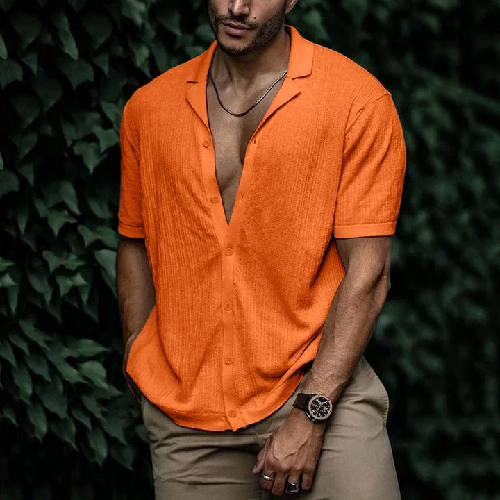 Bright orange textured short sleeve Cuban collar shirt with button front and relaxed fit