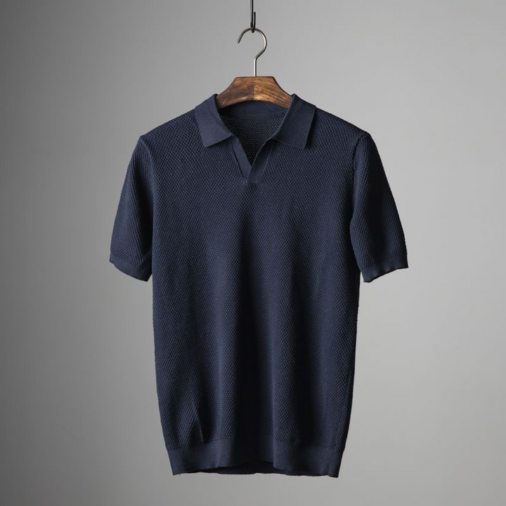 Navy blue textured short sleeve polo shirt with V neck and knit collar