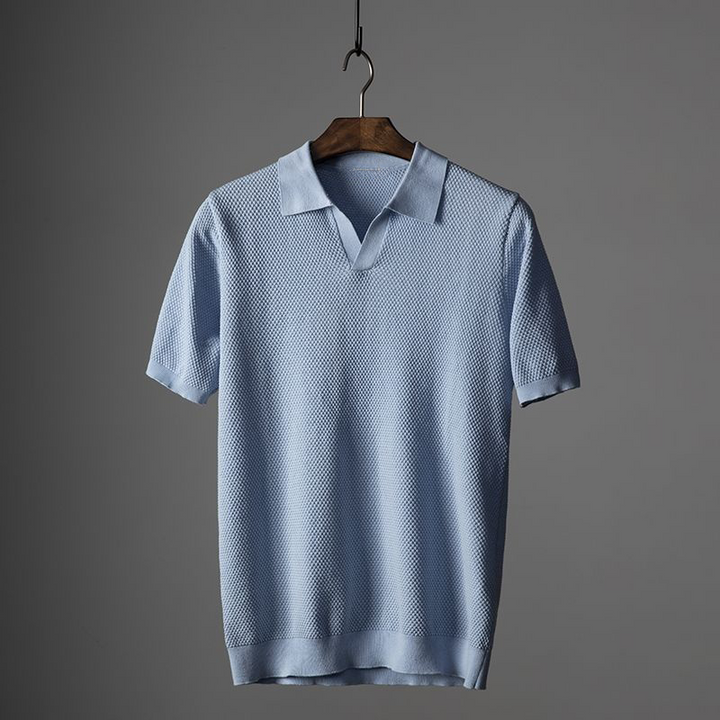 Light blue textured polo shirt for men with V neck, short sleeves, and knit trim