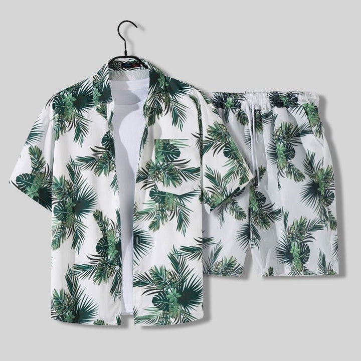 White tropical palm print short sleeve shirt and matching shorts set with green leaf pattern