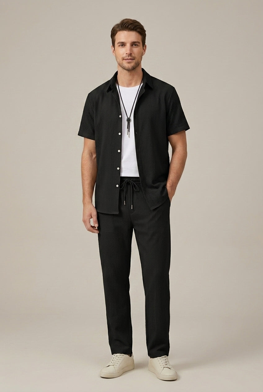 Black waffle knit summer shirt and pants set styled with white t shirt and sneakers