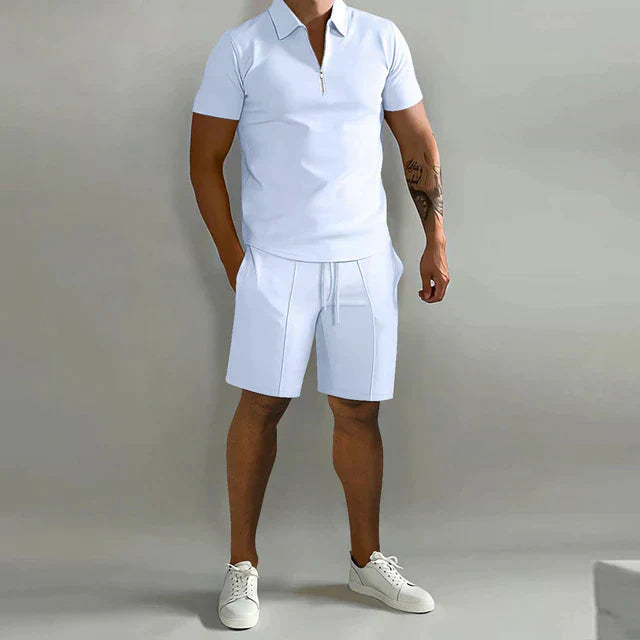 White zip polo shirt with matching white shorts in a clean summer outfit