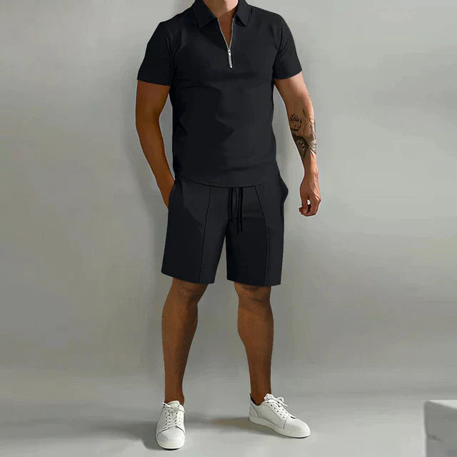 Black zip polo shirt and matching shorts set with casual summer outfit styling