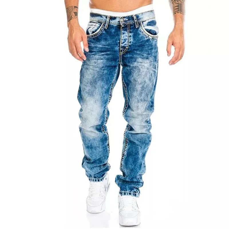 Blue vintage wash baggy jeans with wide legs, faded front panels, and cuffed ankles