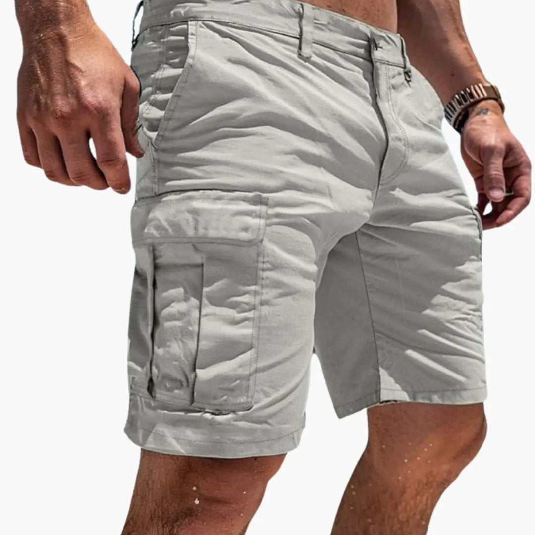Light gray men's cargo knee length shorts with side flap pockets and zipper pocket