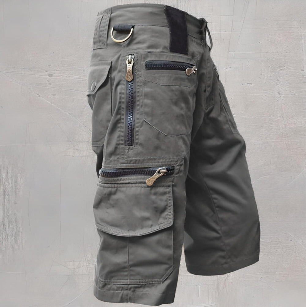 Gray knee length cargo shorts with zip pocket details and side flap pocket