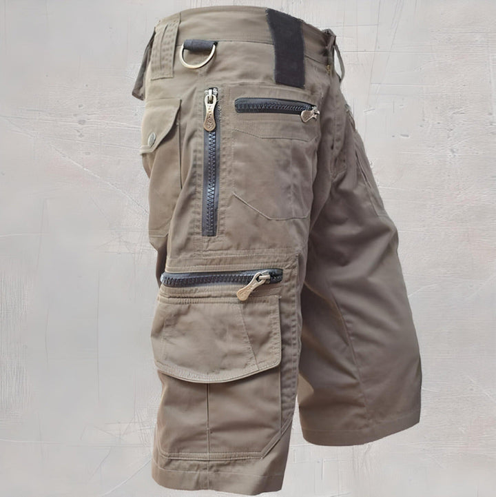 Khaki knee length cargo shorts with zip pockets and utility D-ring accent