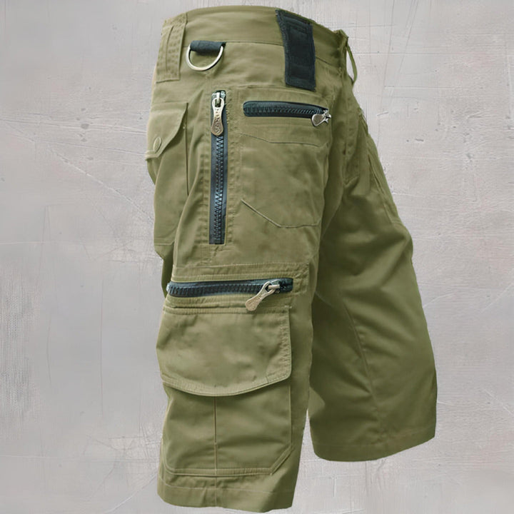 Olive green knee length cargo shorts with front zip pocket and flap cargo pocket