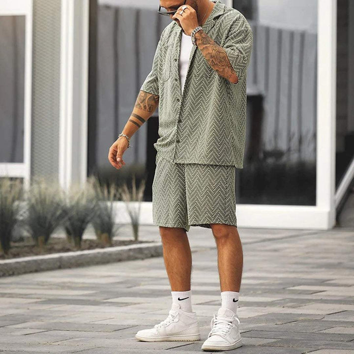 Back view of men's green patterned short sleeve shirt and matching shorts set