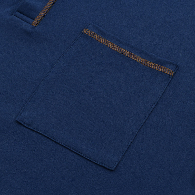 Close-up of navy casual shirt chest pocket with contrast top stitching and soft knit fabric