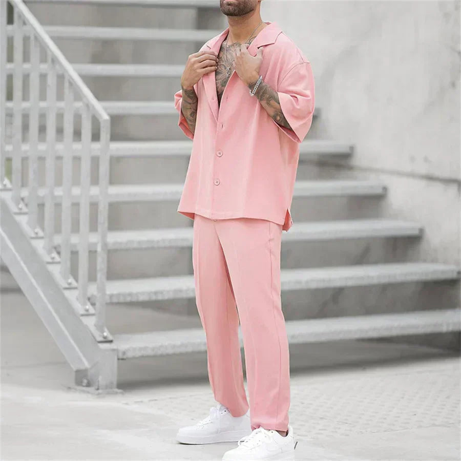 Men's pink summer suit style shirt and pants set shown in a full length front view