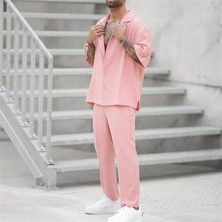 Men's pink summer suit style shirt and pants set shown in a full length front view