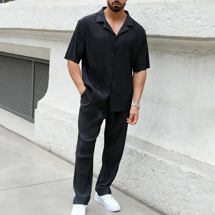 Black pleated camp collar two piece set styled as a casual men's shirt and pants set