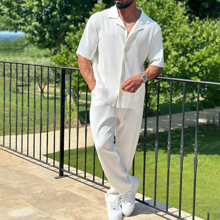 White pleated camp collar two piece set with short sleeve shirt and relaxed pants
