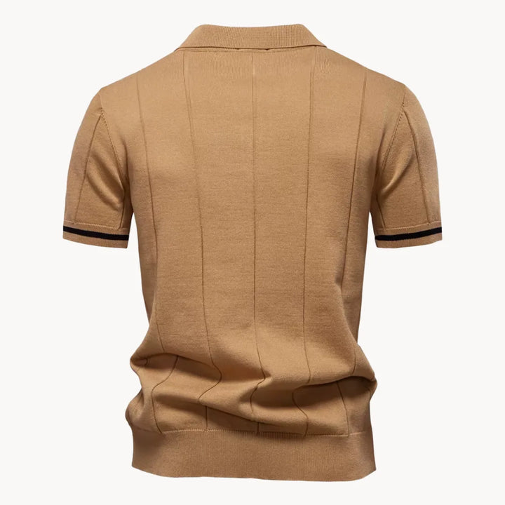 Back view of tan short sleeve knit polo shirt with vertical ribbed texture and straight hem