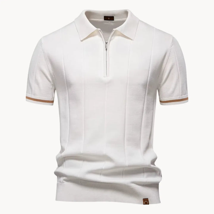 White knit polo shirt with short sleeves, zip neckline, and tan striped cuff trim