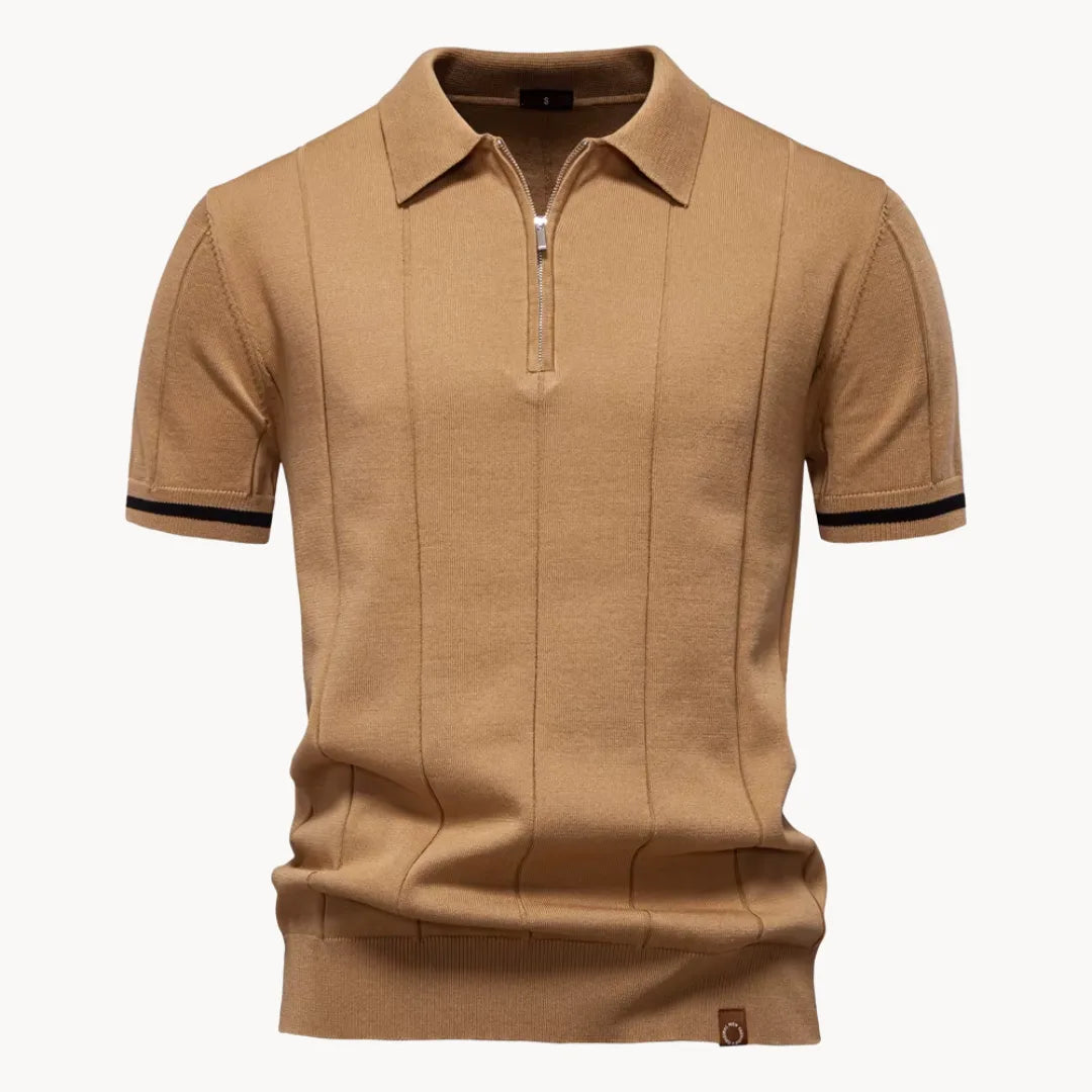 Tan knit polo shirt with short sleeves, zip placket, and black striped sleeve cuffs