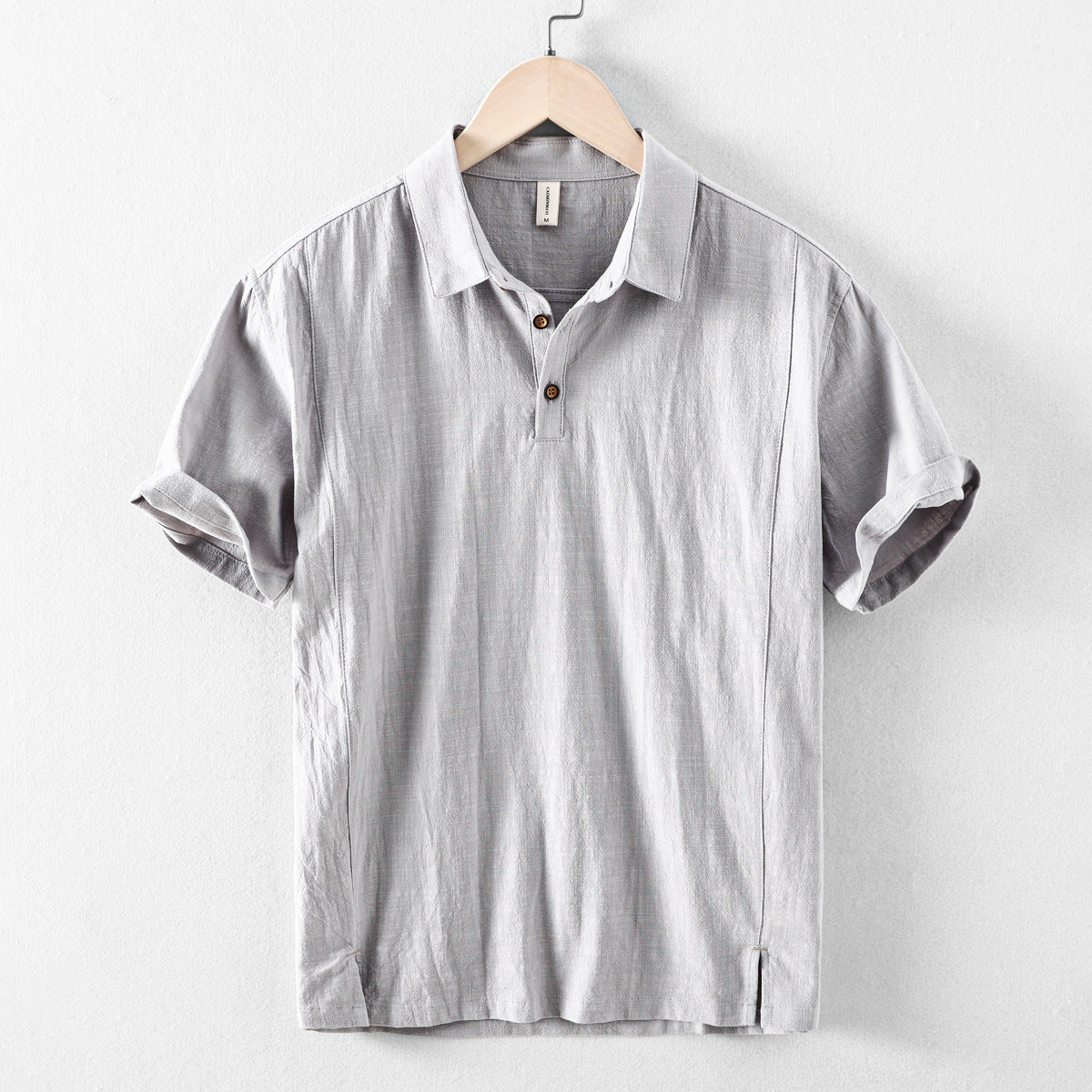 Light gray men's casual short sleeve linen shirt with polo collar and button placket