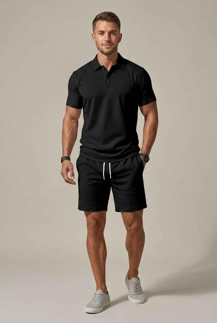 Black short sleeve polo shirt and matching black shorts set with white drawstring, casual men's summer outfit