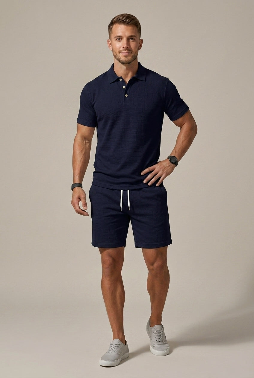 Navy blue short sleeve polo shirt and shorts set with textured fabric and drawstring shorts for men