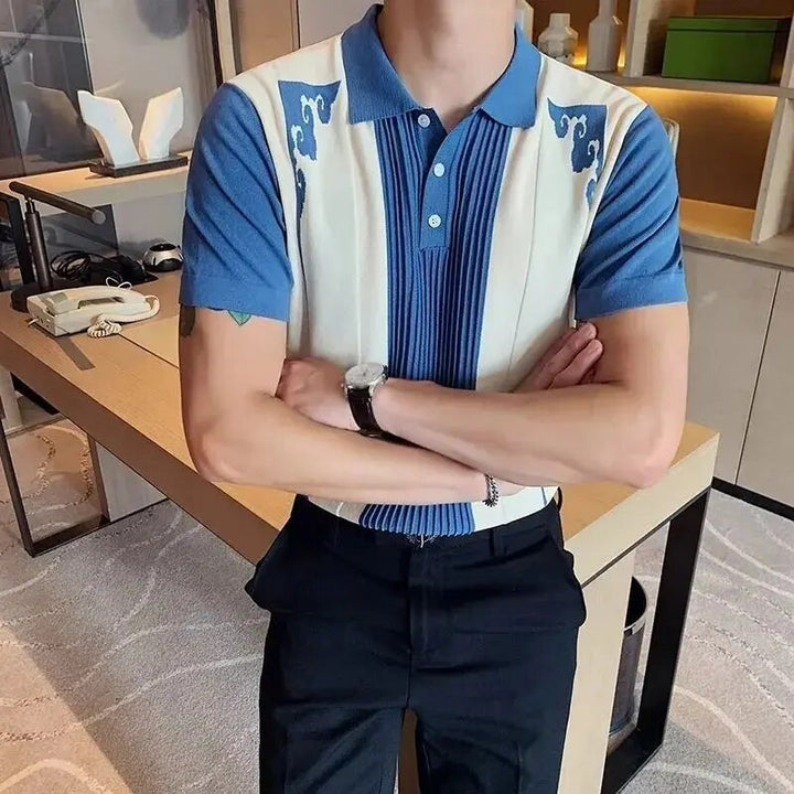 Blue and cream ribbed panel polo shirt with short sleeves and button placket, styled with black pants