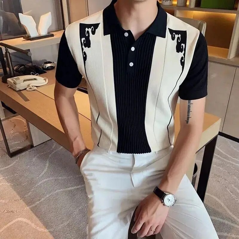 Black and white ribbed panel polo shirt with short sleeves and button placket, styled with white pants