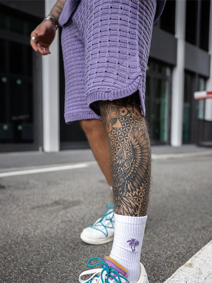 Close-up of purple knit shorts set showing textured sleeveless shirt and matching shorts