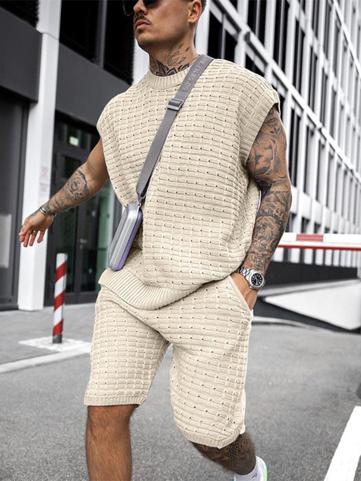 Beige sleeveless knit shorts set with textured shirt and matching shorts on a man