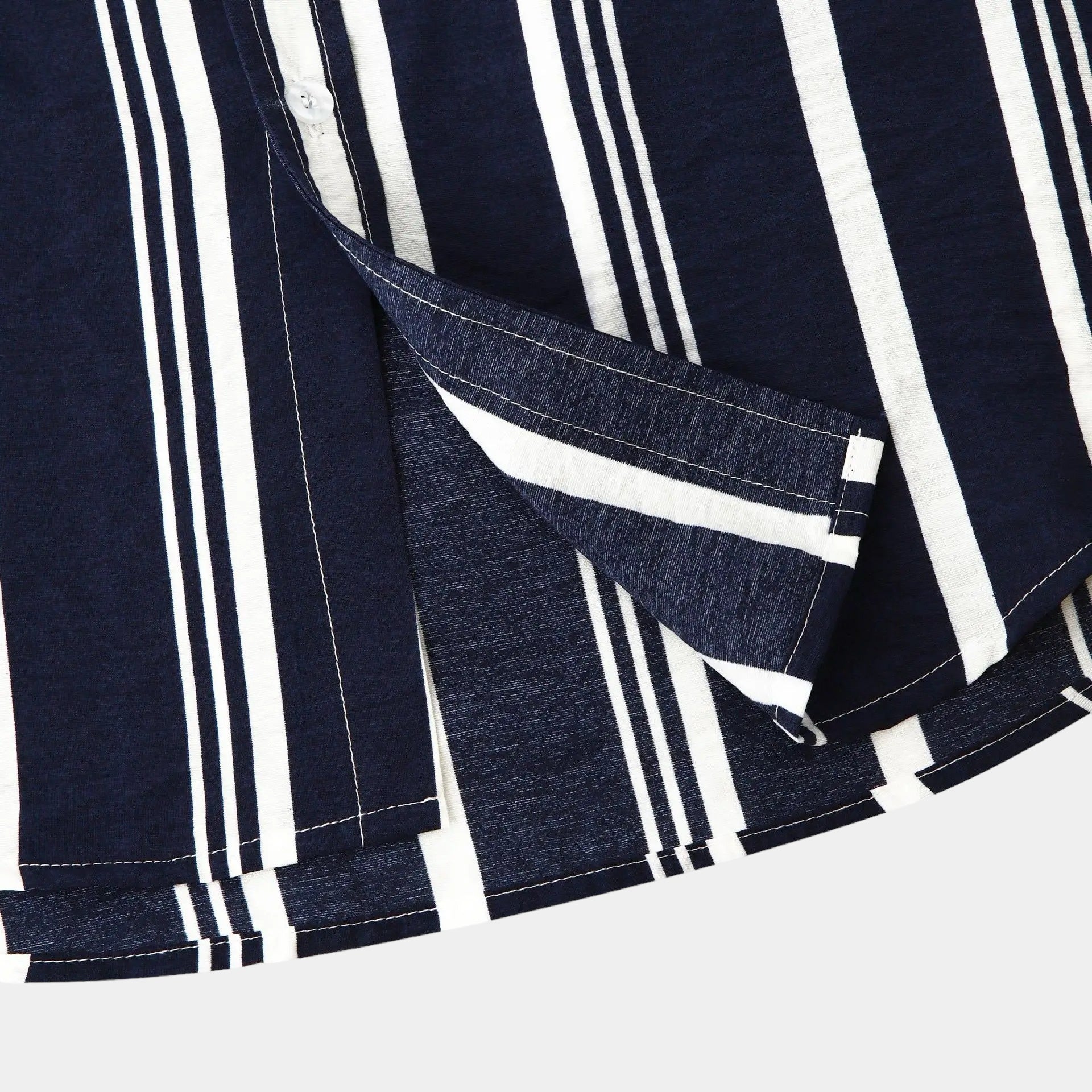 Close-up of navy striped button up shirt showing collar, placket, and short sleeve cuff