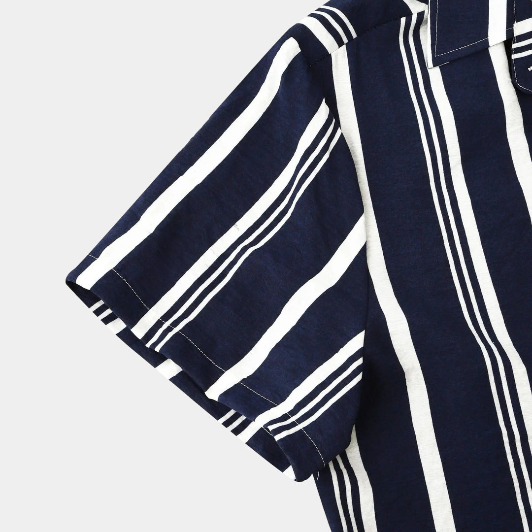 Side close-up of navy t shirt style button up with bold white stripes and textured fabric