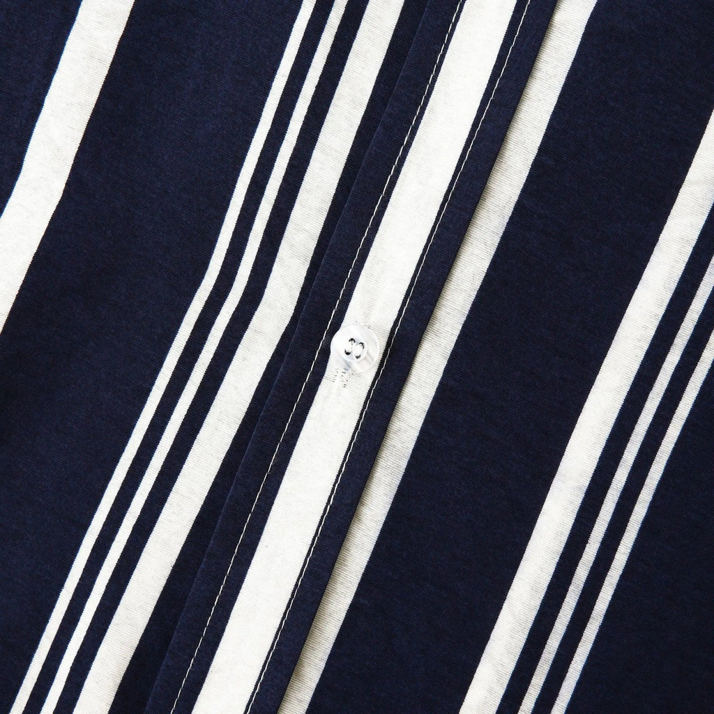 Close-up of shirt sleeve and hem on navy striped short sleeve button up shirt
