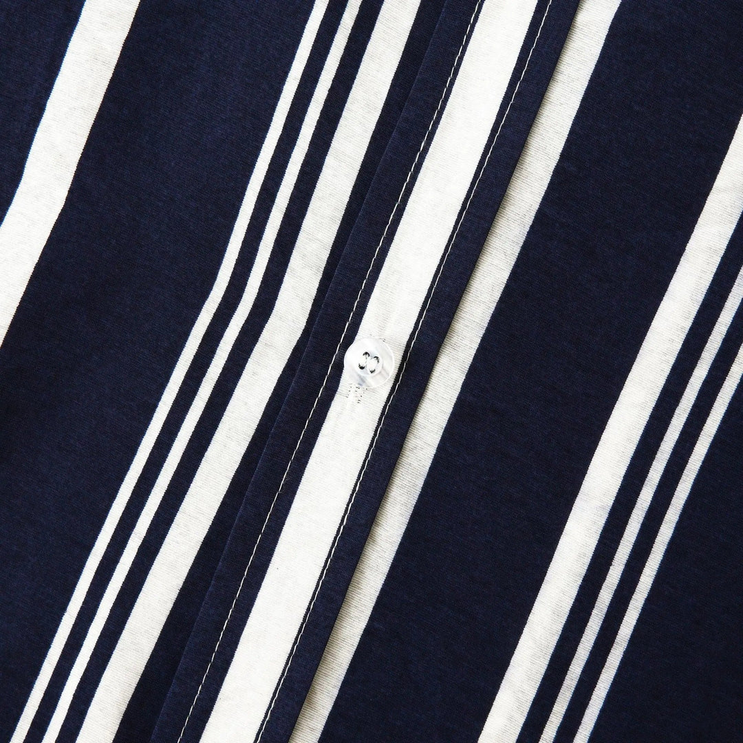 Close-up of shirt sleeve and hem on navy striped short sleeve button up shirt