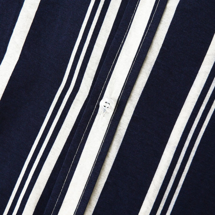 Close-up of shirt sleeve and hem on navy striped short sleeve button up shirt